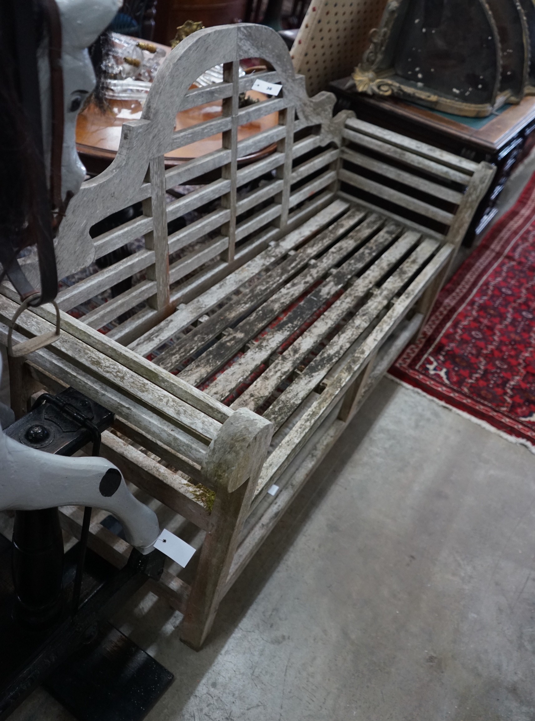 A Lutyens style weathered teak garden bench from 'The Cotswold Collection', width 166cm, depth 52cm, height 105cm